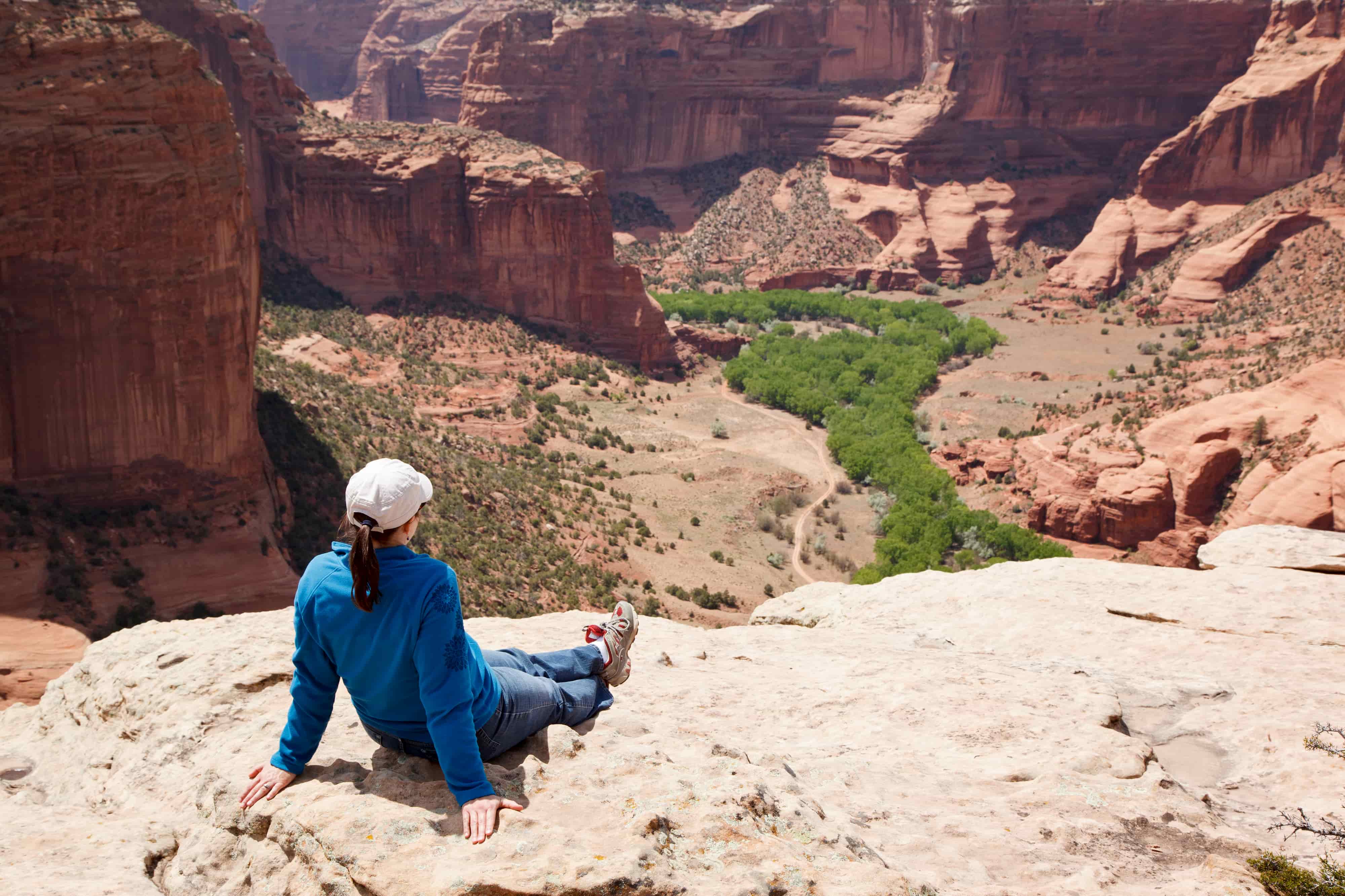 Hiker sitting overlooking Canyon de Chelly