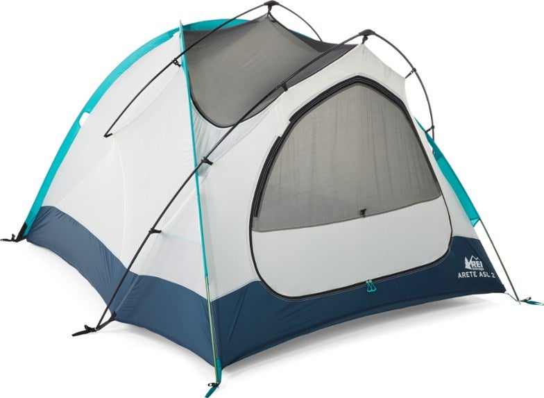 white winter camping tent with blue trim 