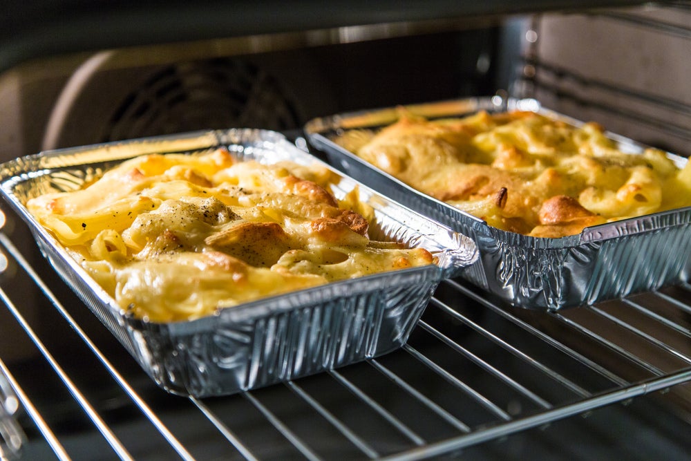 maceroni and cheese in a foil tin in the oven