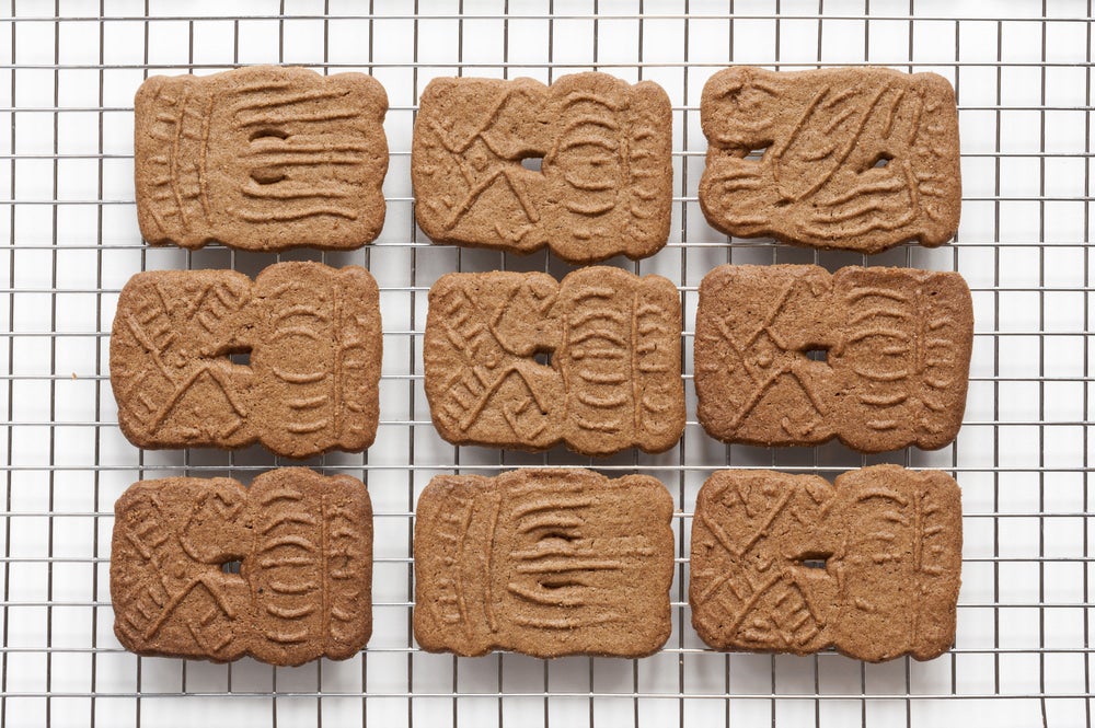 Speculaas cookies on a cooling rack.