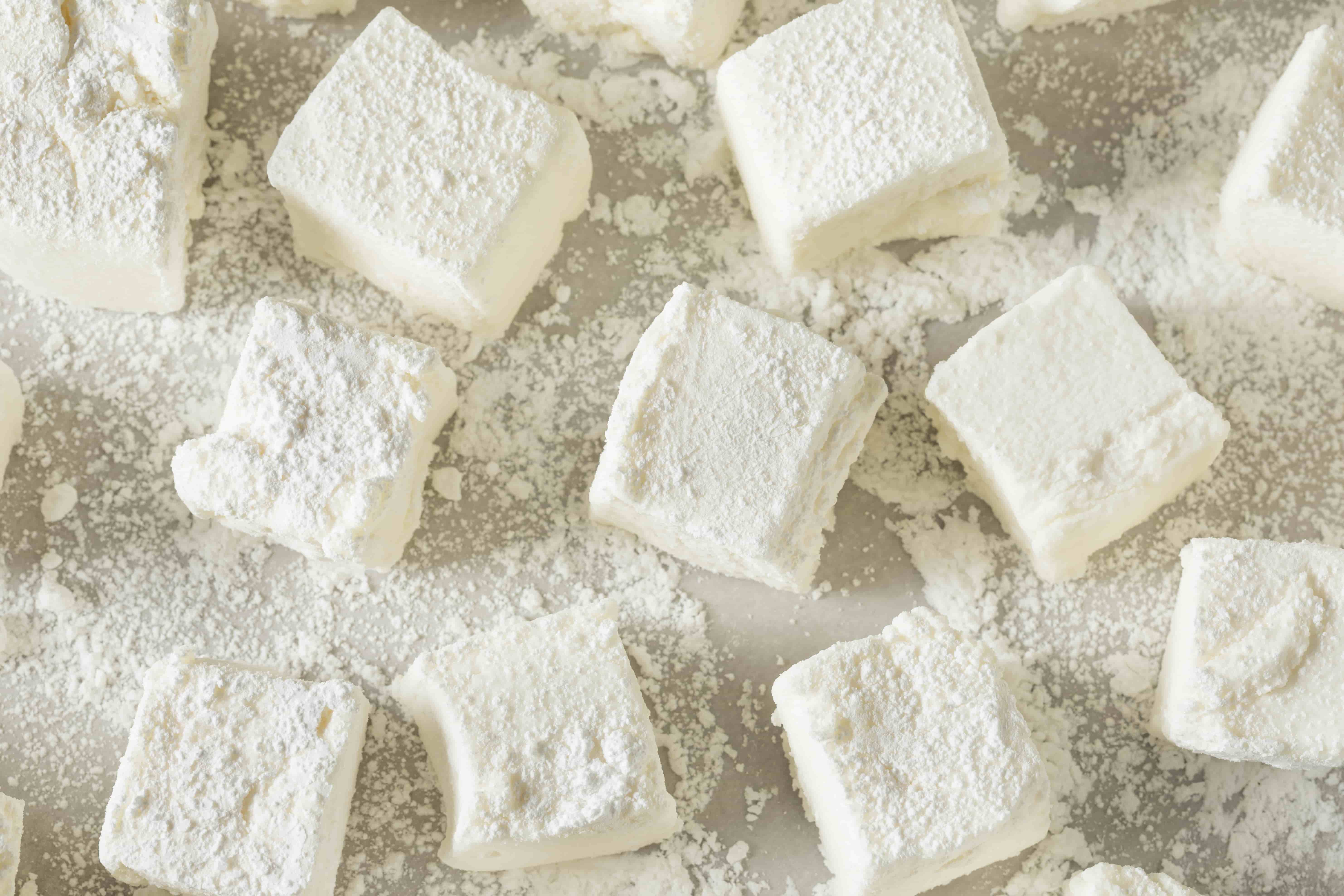 Flour dusted homemade square marshmallows.
