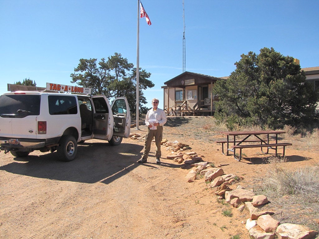 man next to car in front of Hans Flat Ranger Station