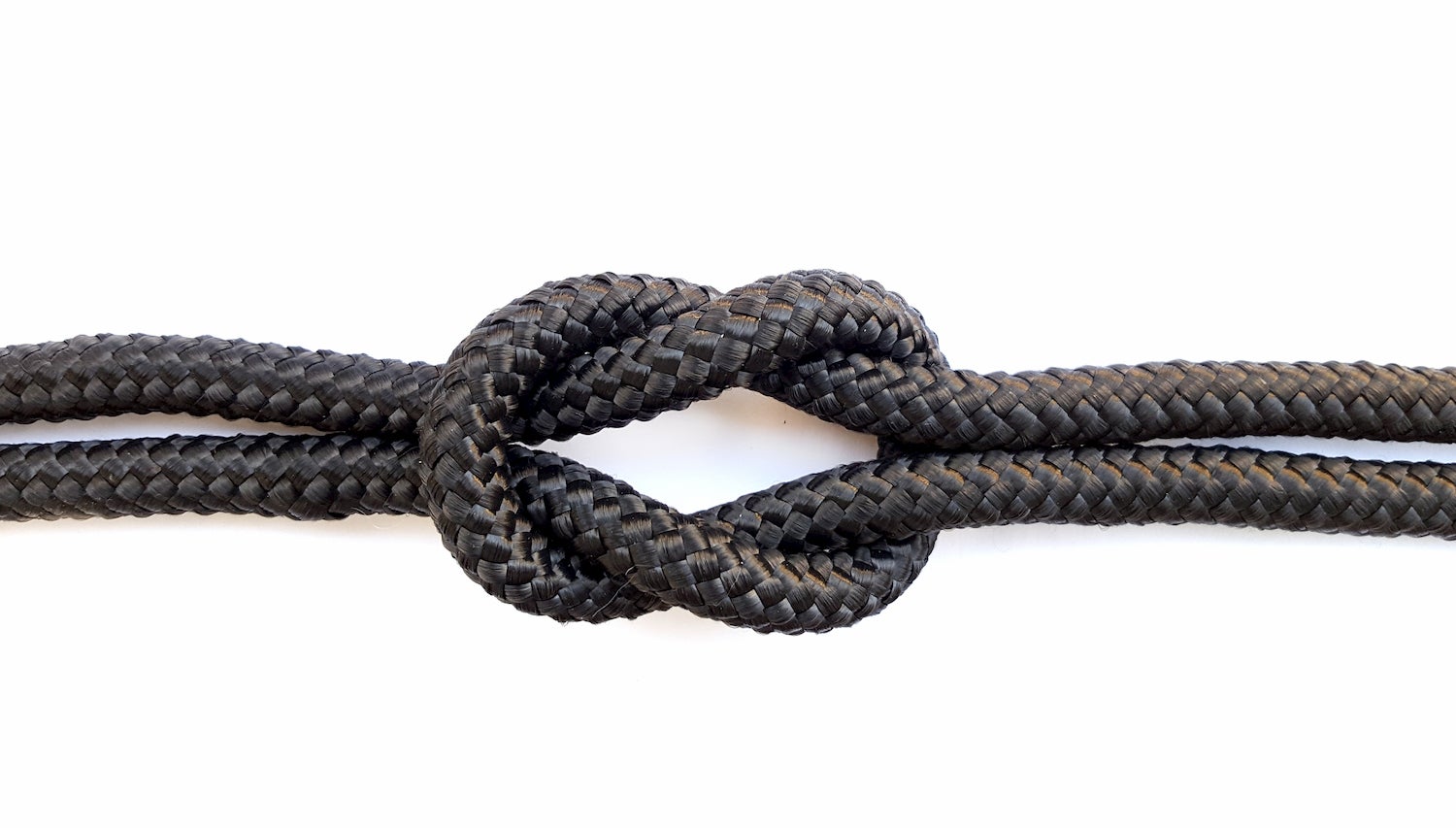 Black rope tied into a square knot.