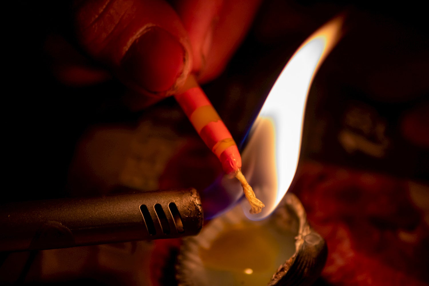 wax covered string aflame