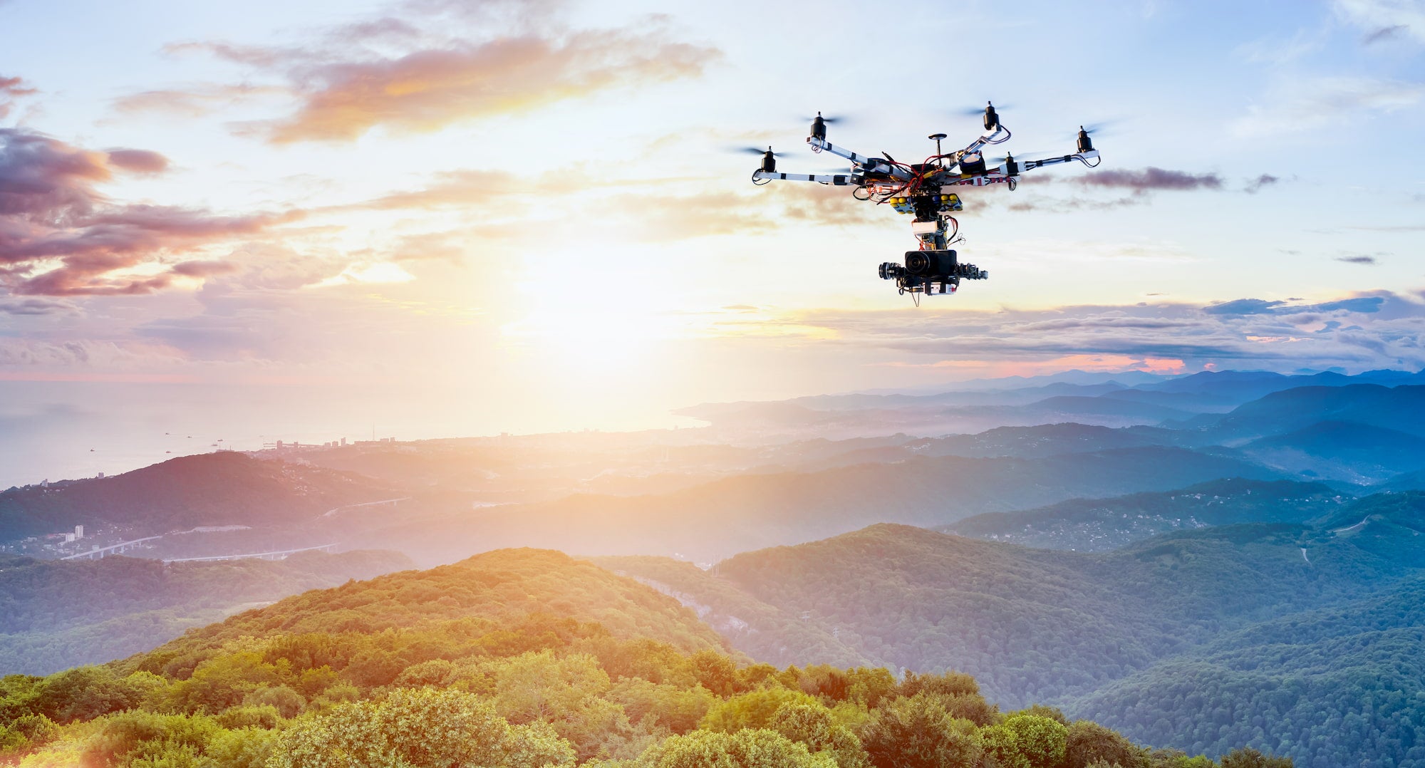 professional drone flying over landscape