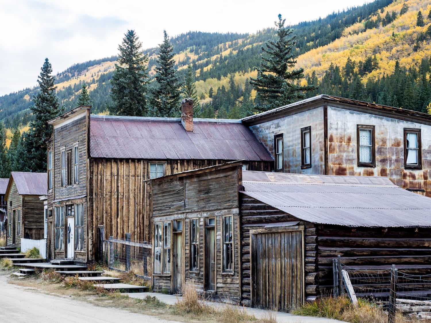 several abandoned wooden buildings