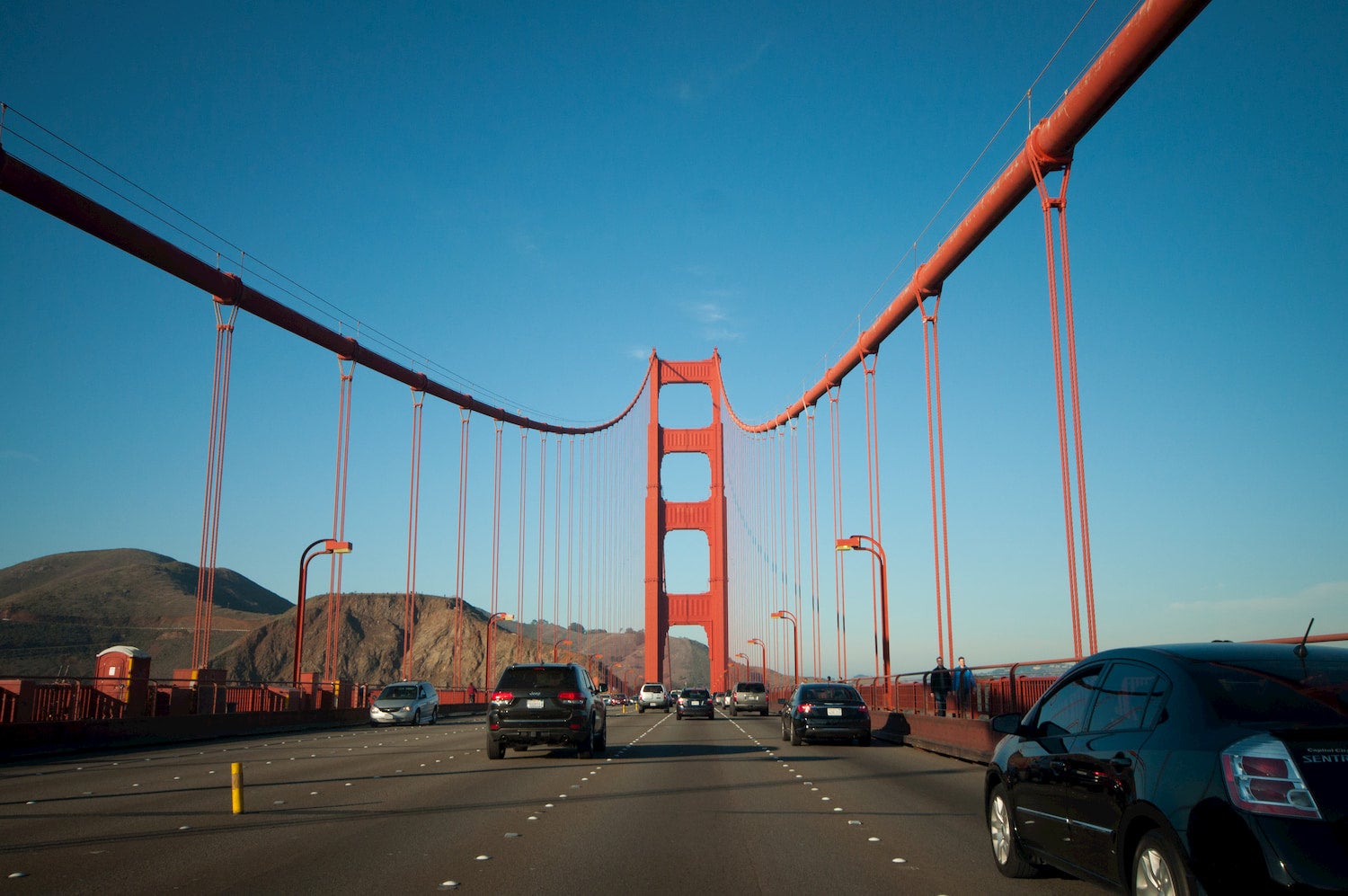 cars driving on the golden gate bridge
