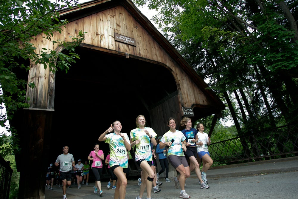 runner coming out from under covered bridge