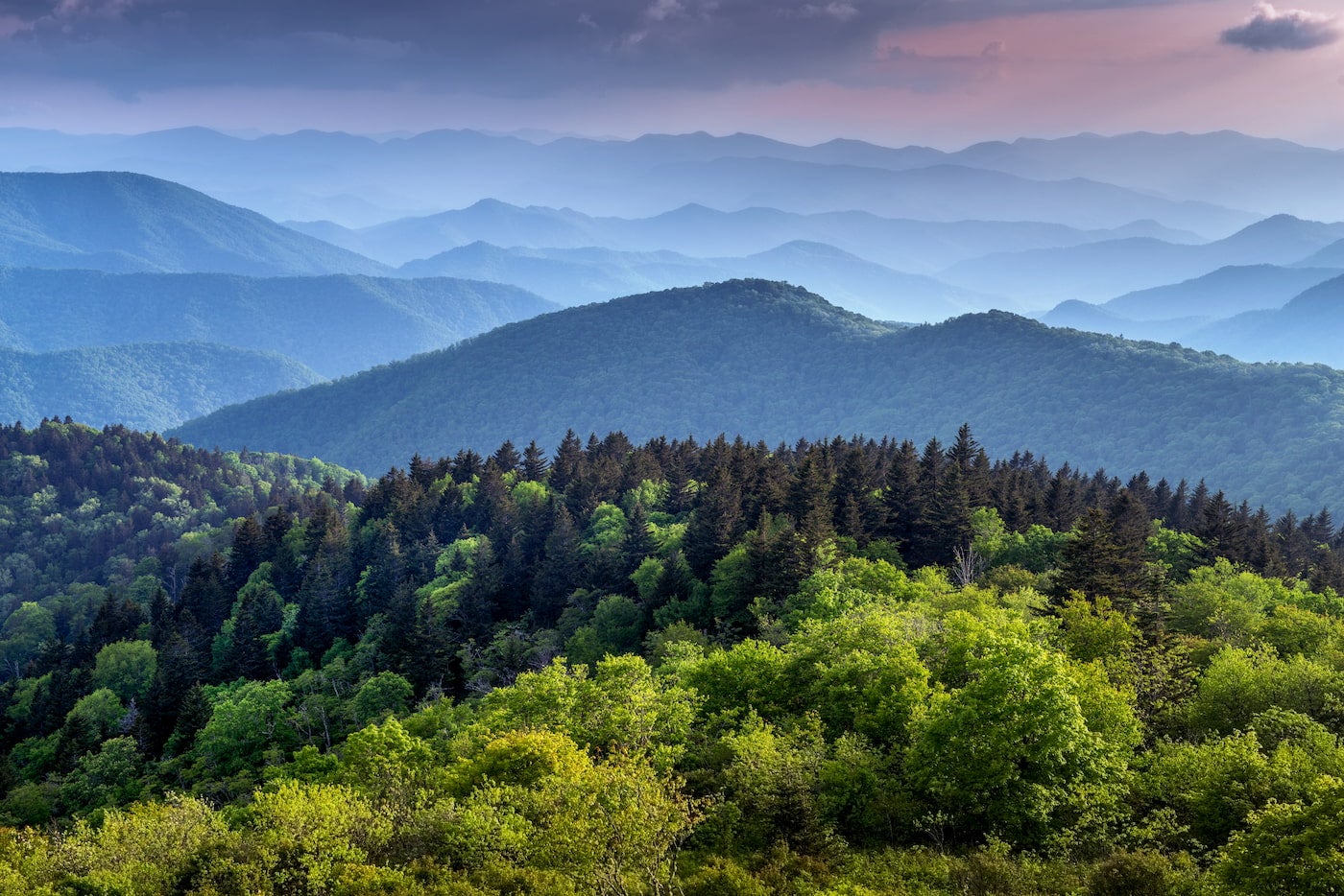 Landscape of mountain peaks in the Smokey Mountains at dusk.