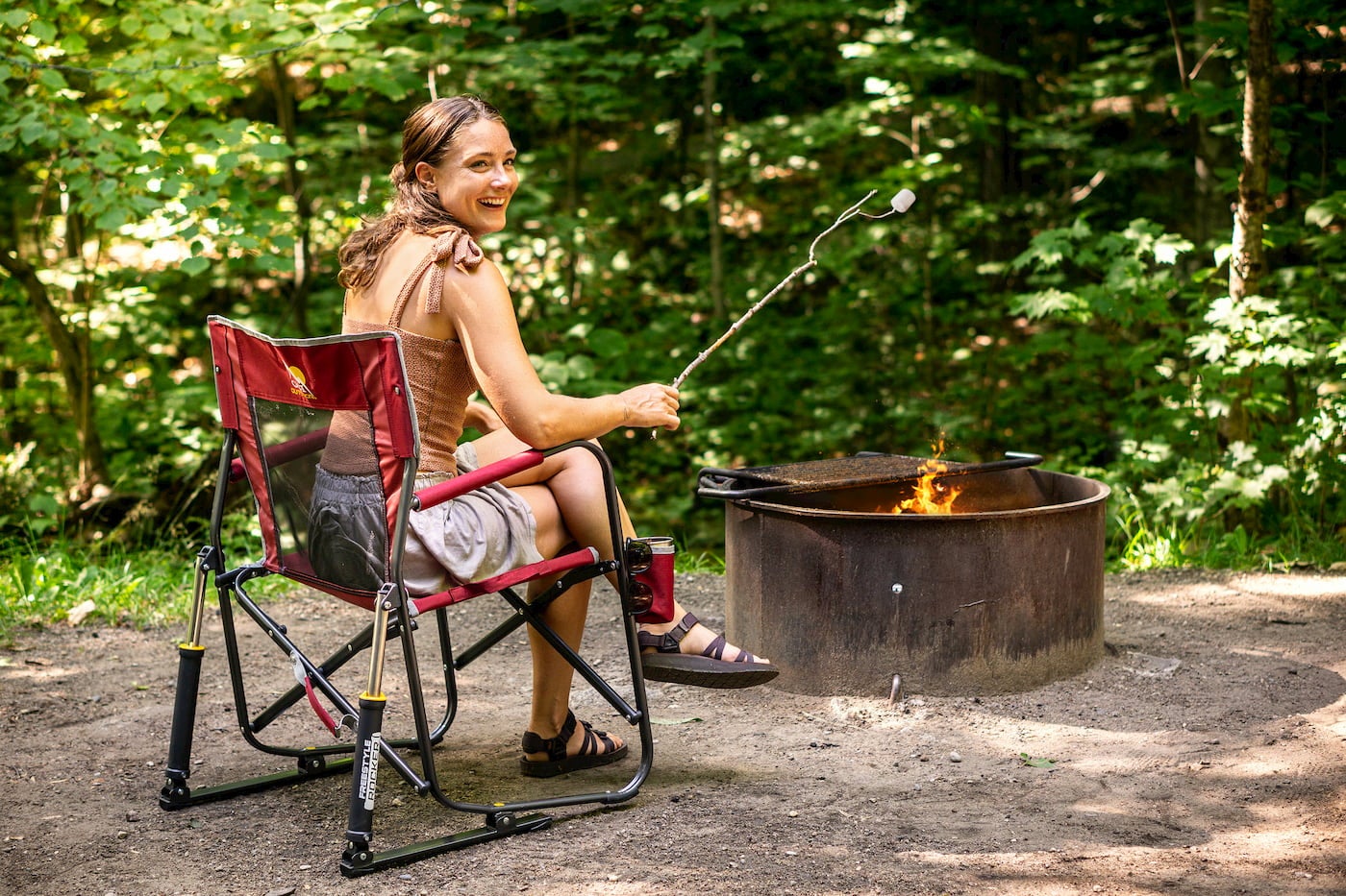 GCI outdoor chair used for grilling over a campfire.