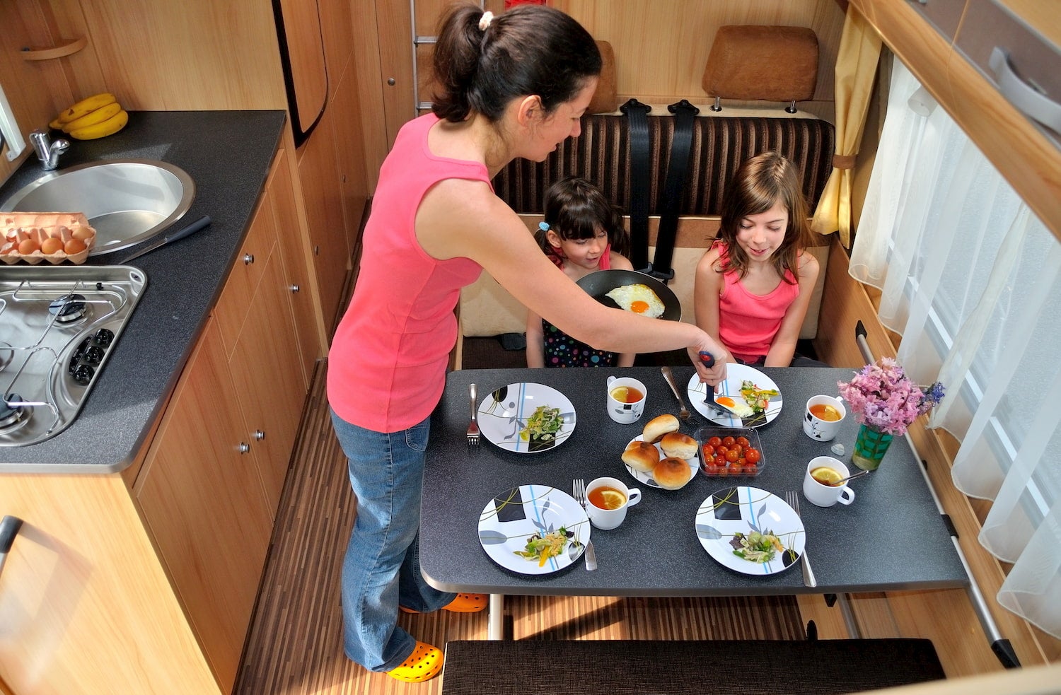 family eating dinner in RV