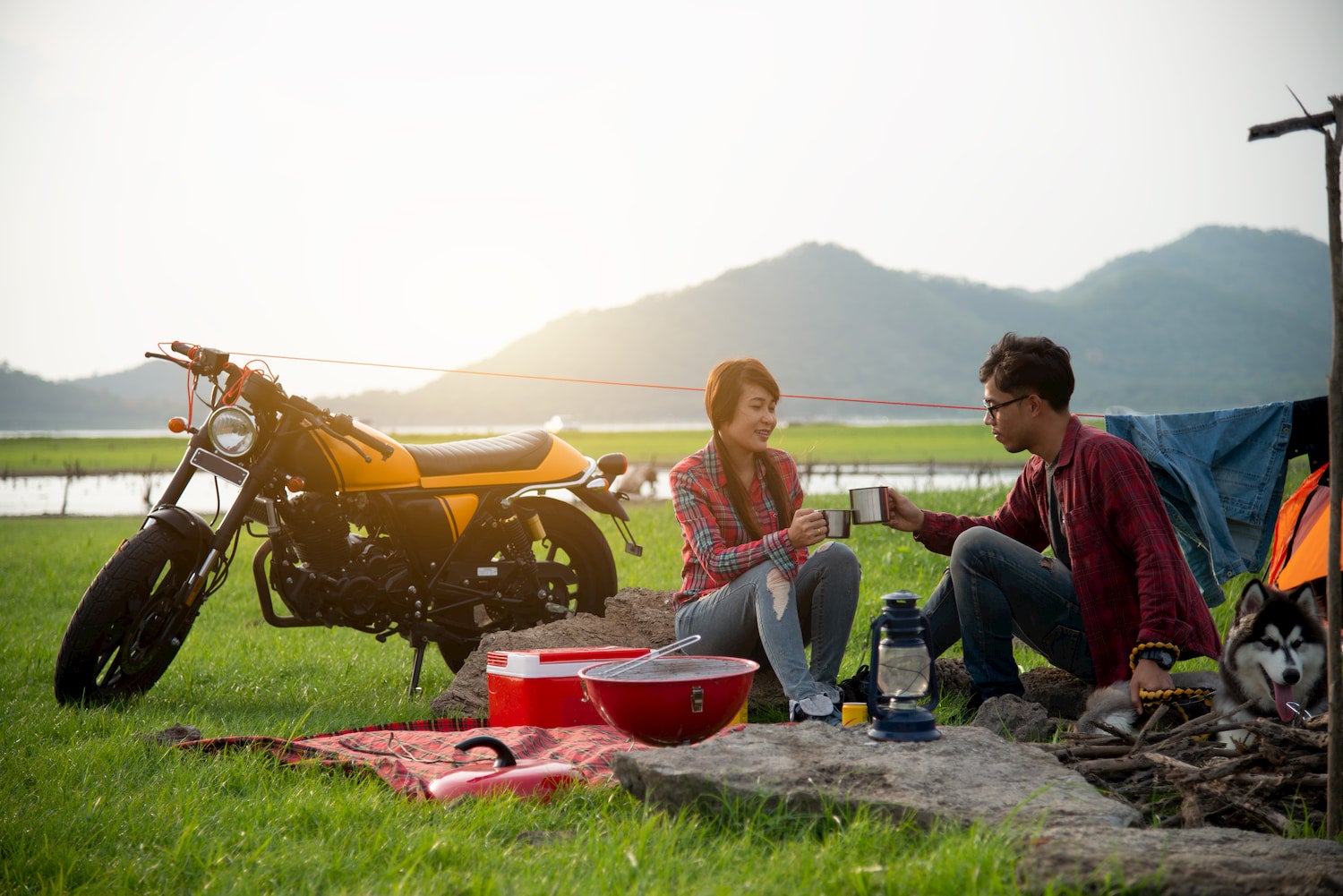 couple eating food while motocamping