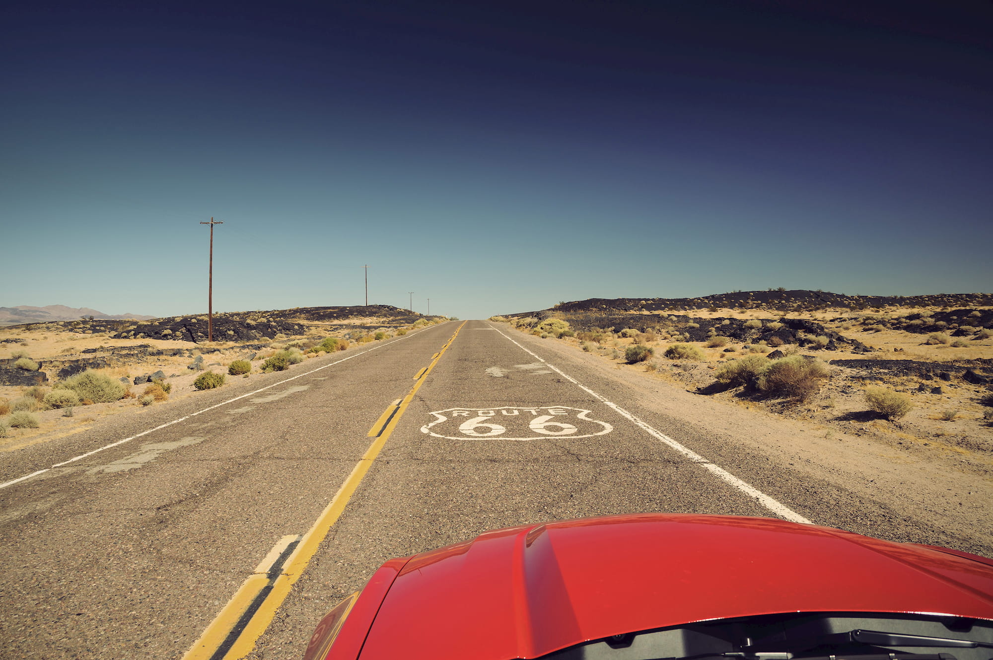 route 66 sign painted on road