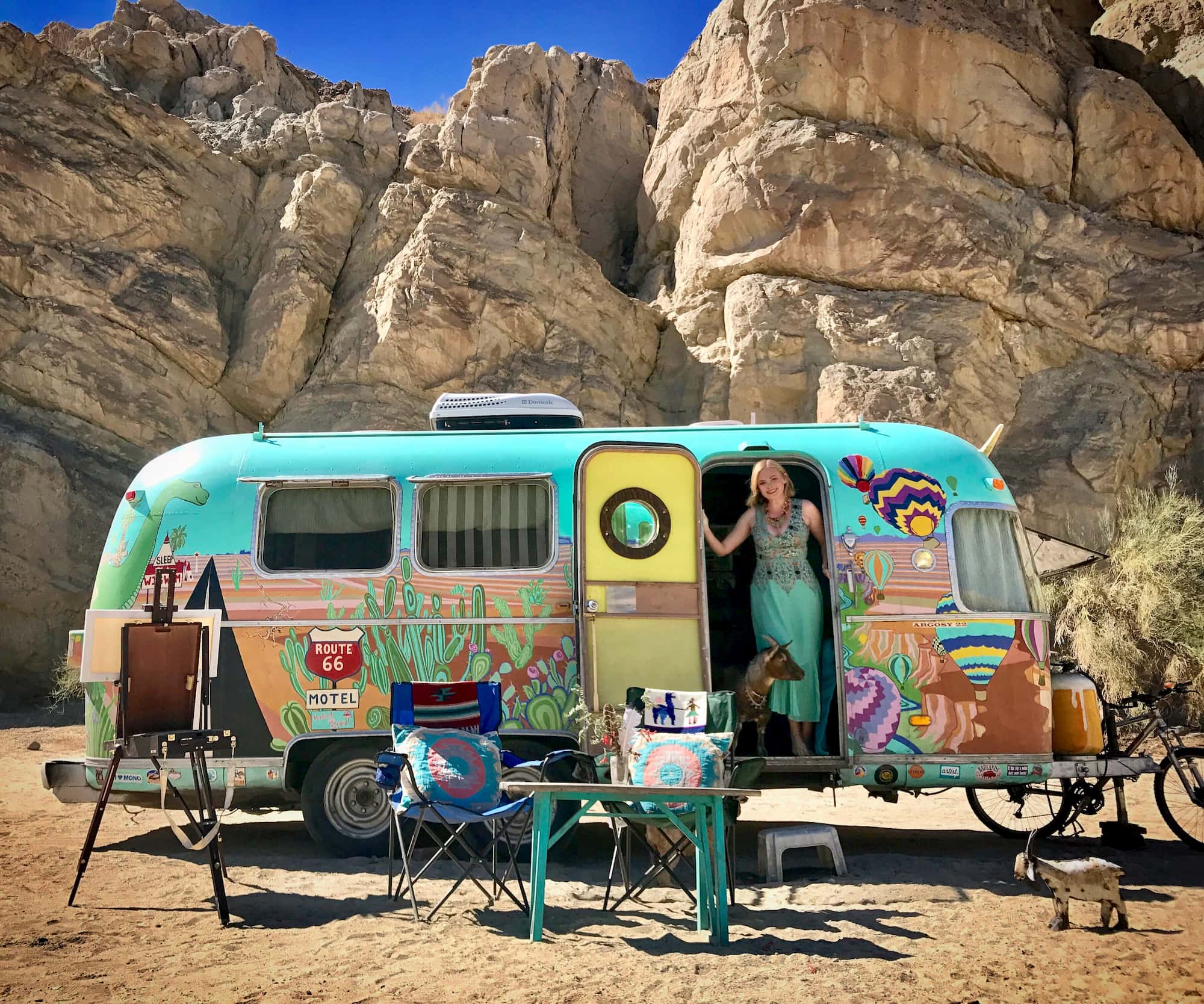Cate of Argosey Odyssey posing with her hand painted airstream.