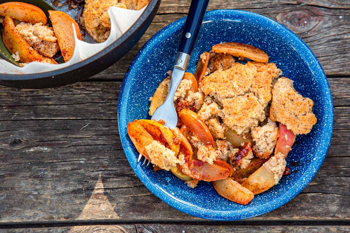 Apple cobbler baked in a dutch oven, a great fall camping recipe.