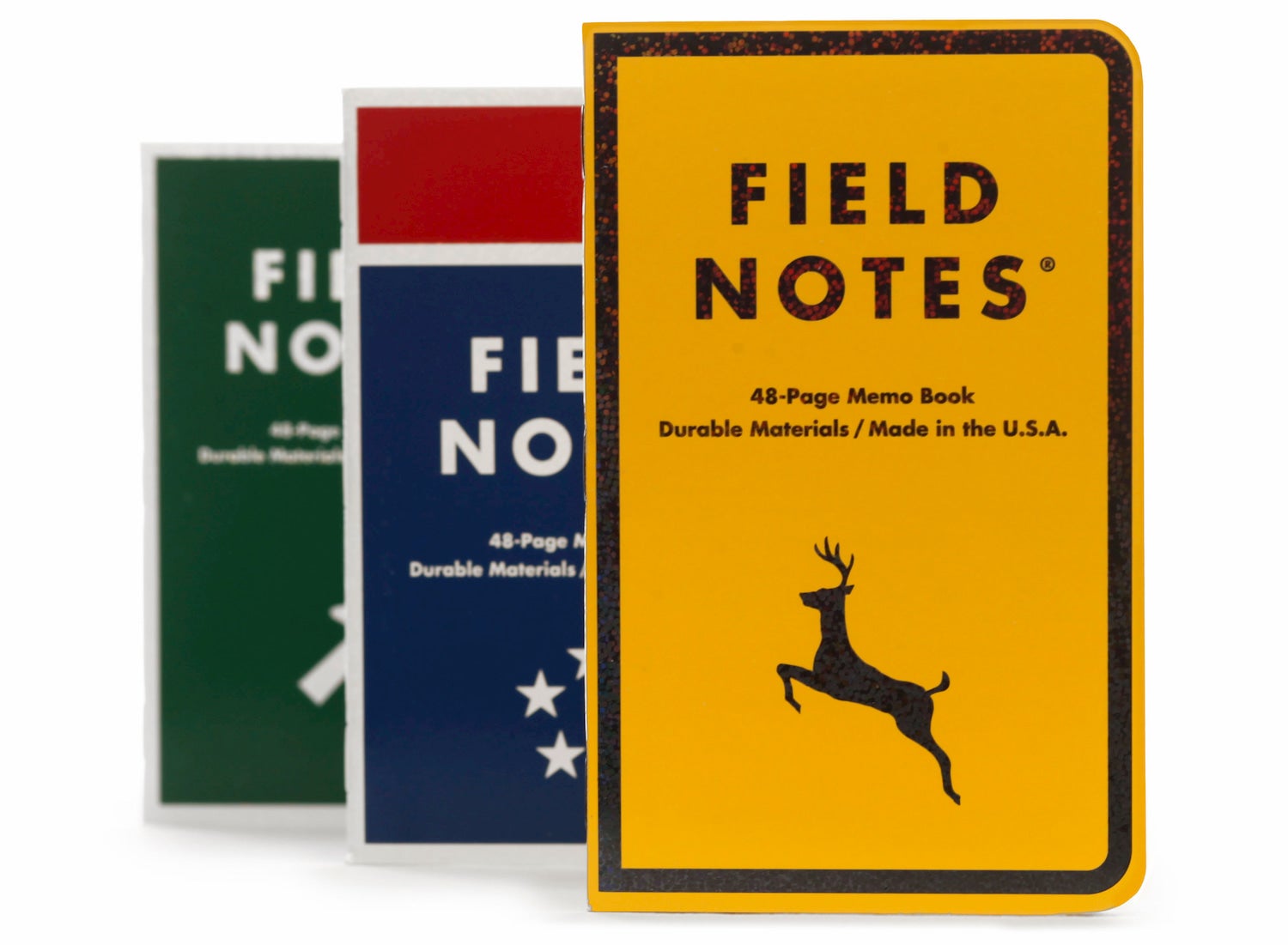 three field note notebooks side by side