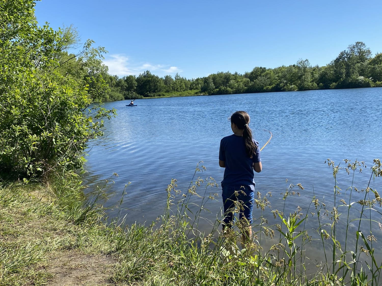 girl fishing at lake