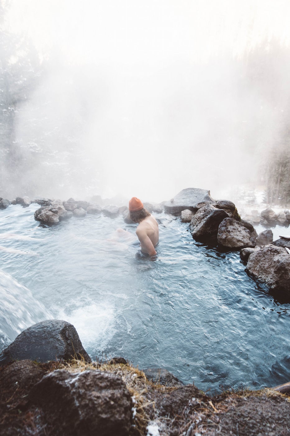 Man soaking in hot spring.