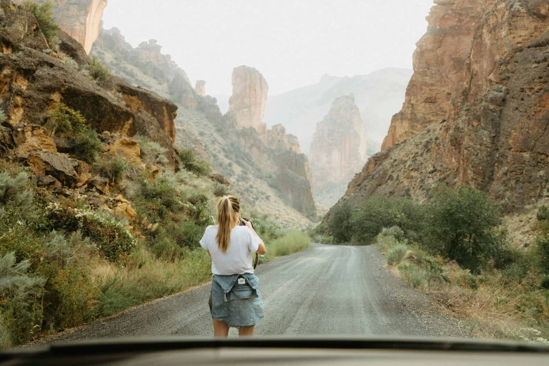 Women exploring in Eastern Oregon surrounded by rock formations.