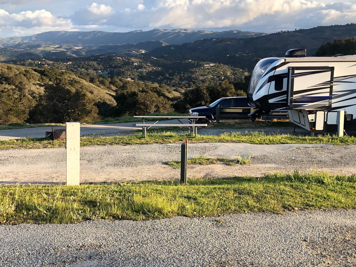 pull-behind parked at rv site with vista in background