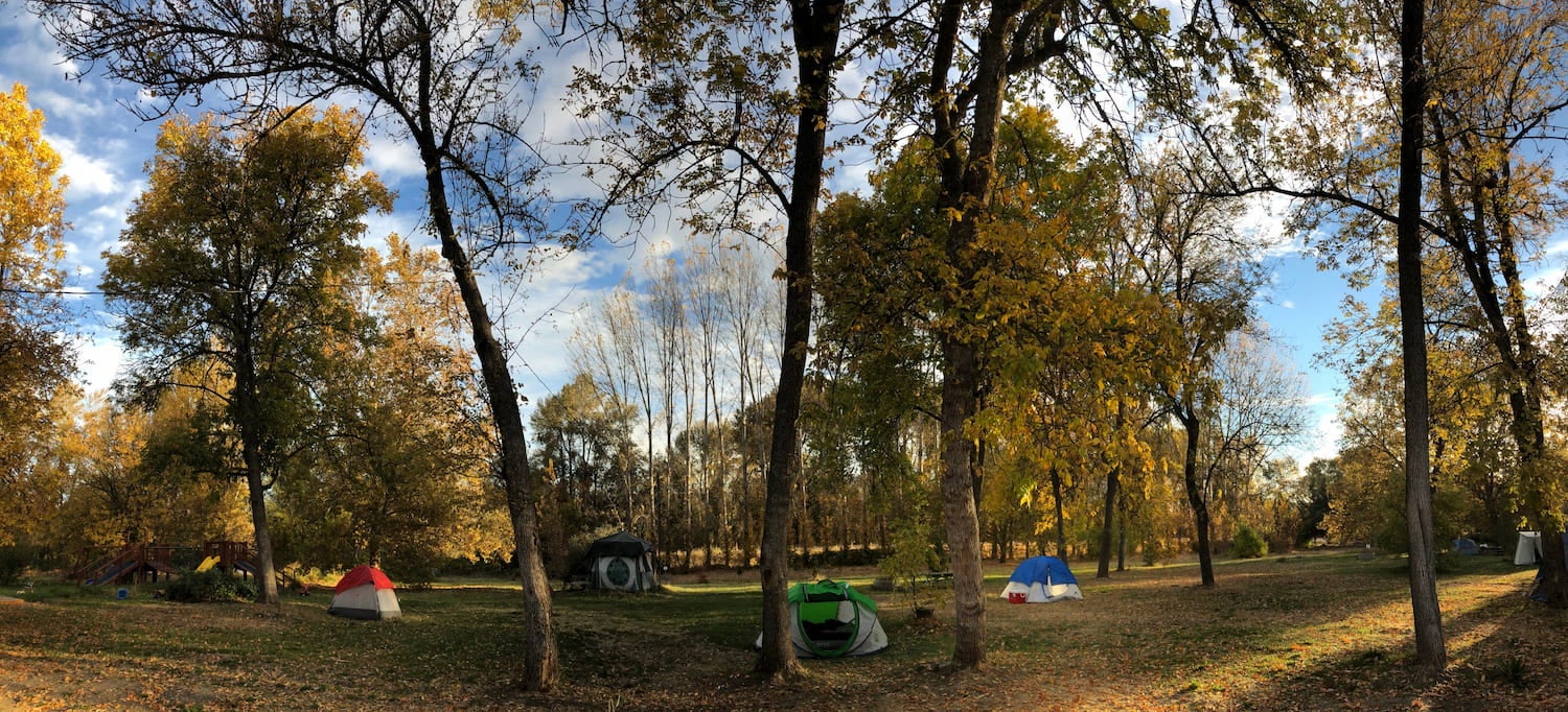 a few tents in a meadow