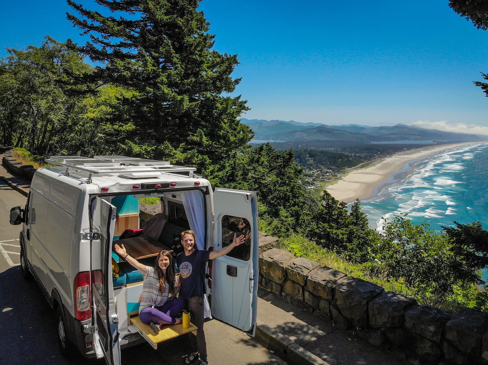 Two Wandering Soles in their van on the coast California.