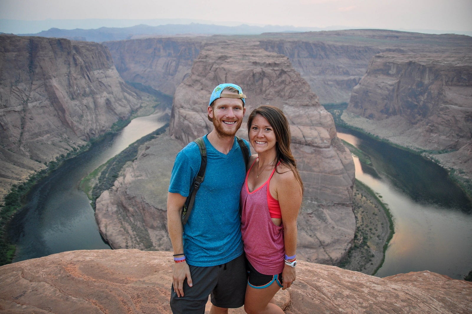 Ben and Katie of Two Wandering Soles posing in front of Horseshoe Bend.