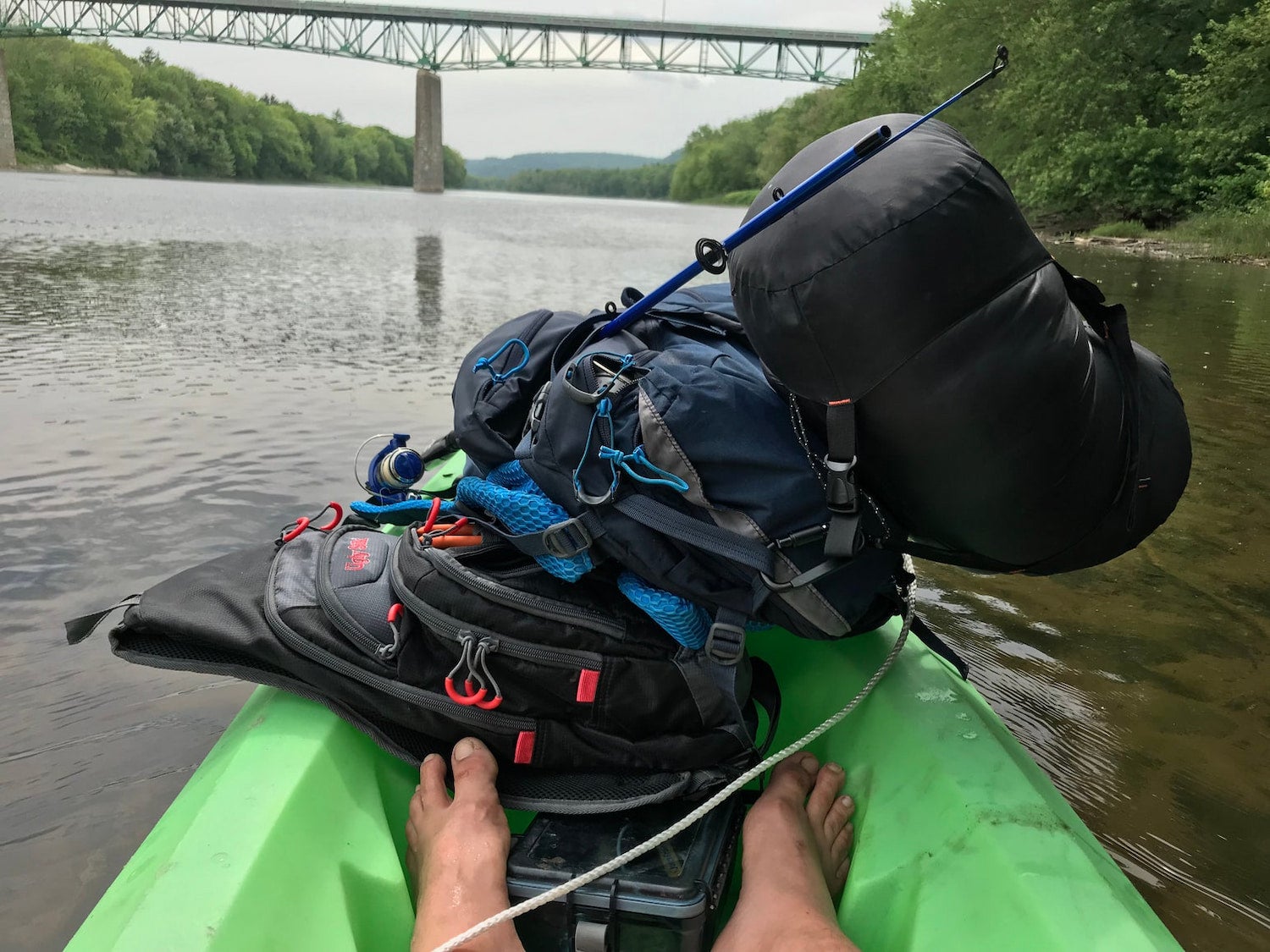 feet and gear inside of kayak