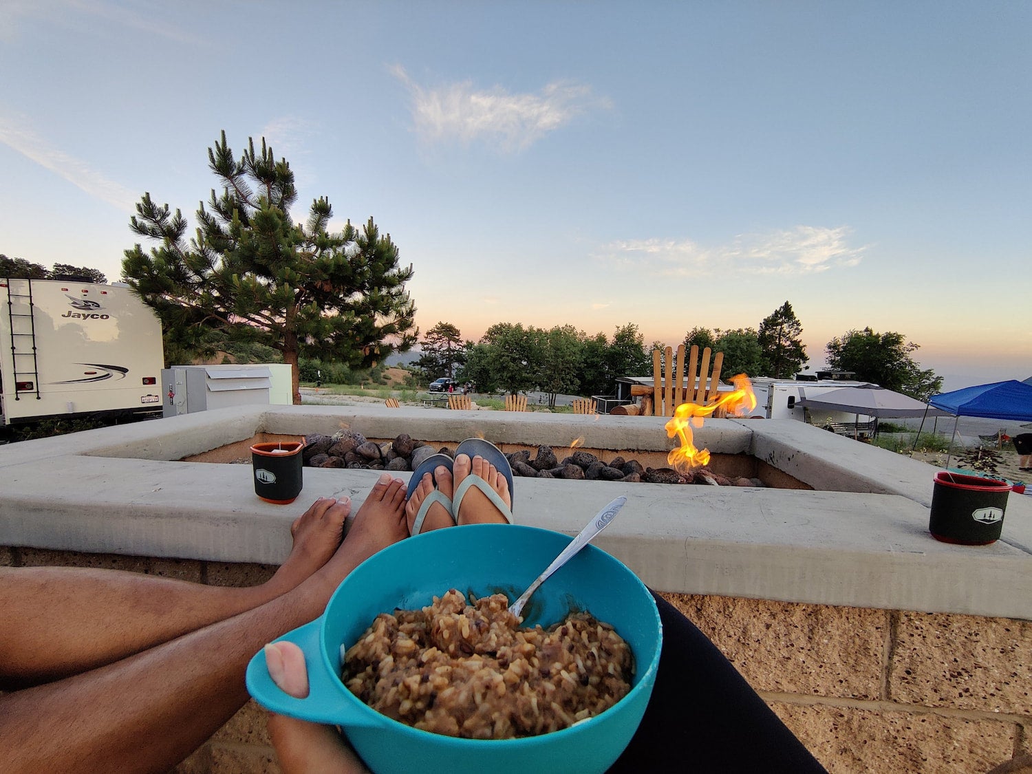 food and feet by a fire