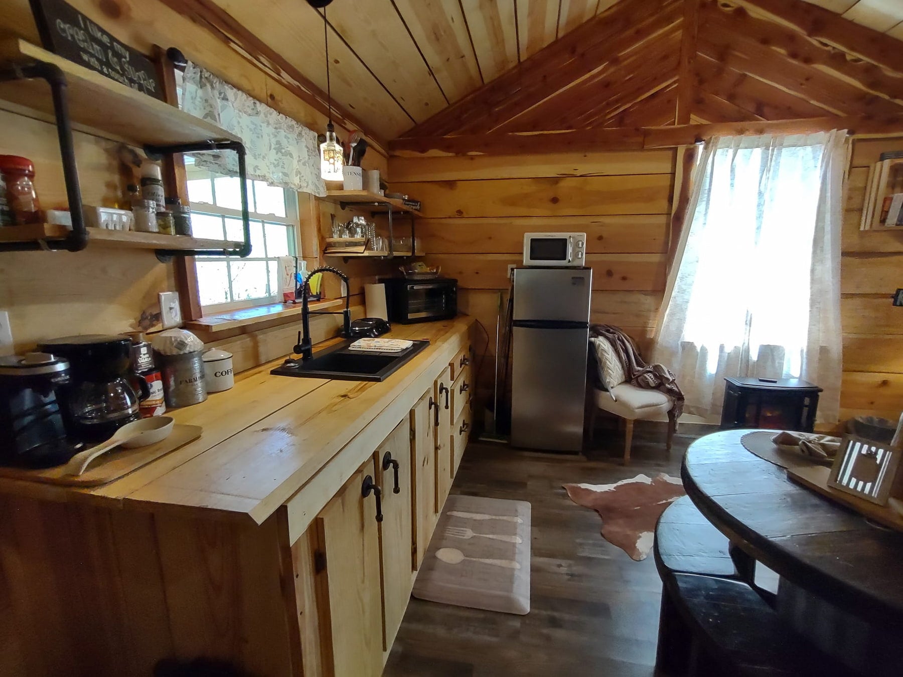 Interior of wooden glamping cabin in Arkansas.